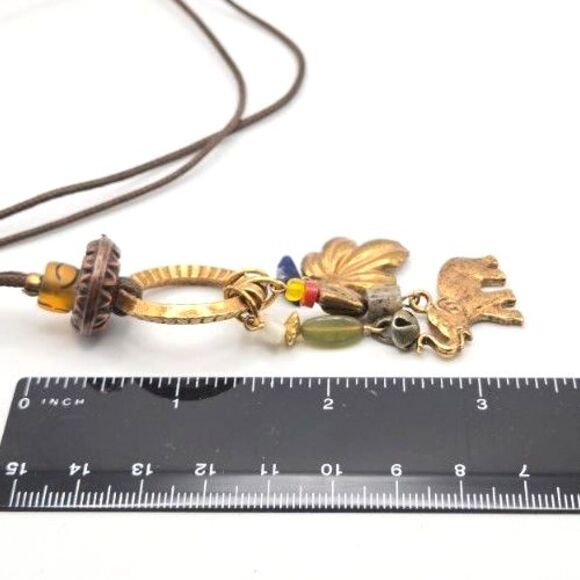 Brass Tone Y-Drop Charm Necklace on Cord with Elephant Bell Leaf and Bead Charms - Picture 5 of 5